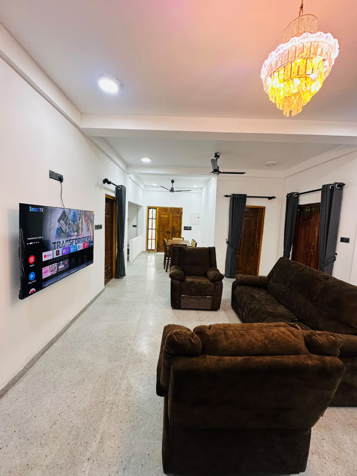 Lounge area connecting the television wall and entrance passage