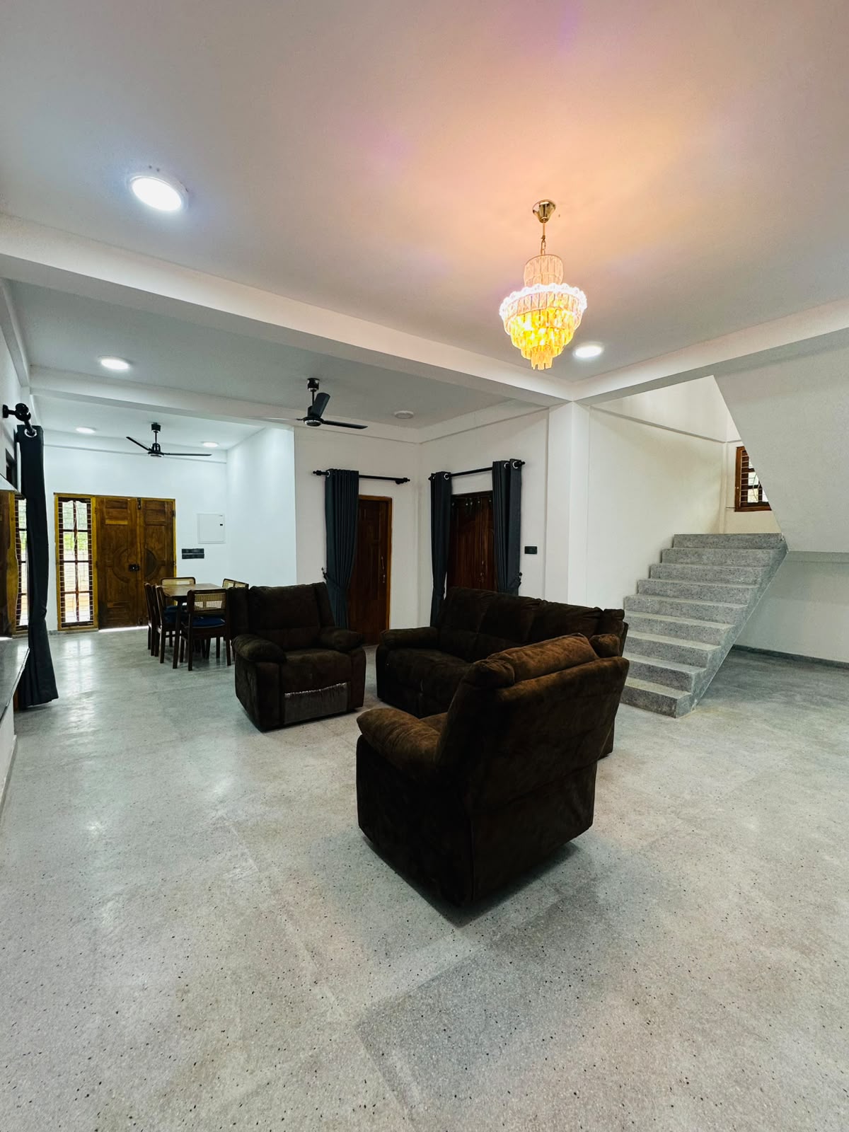 Open-plan lounge with staircase and seating area