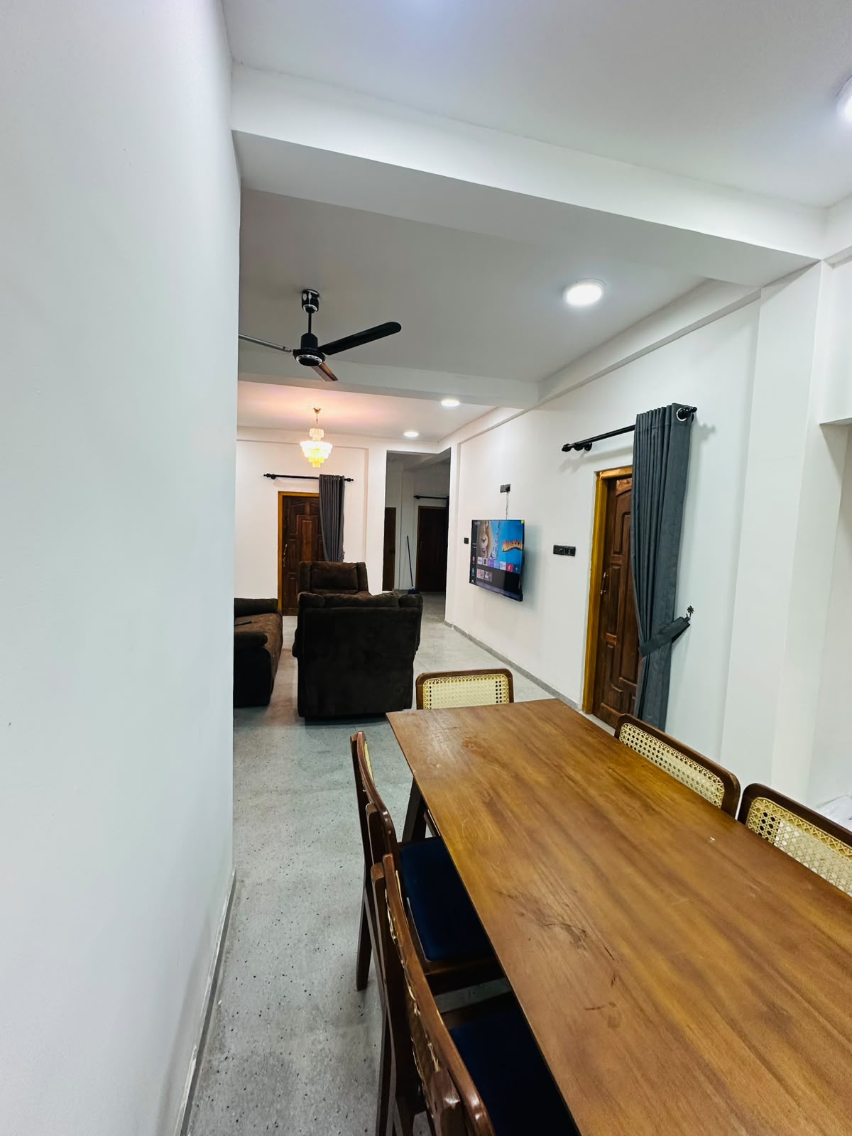 Lounge with television wall and warm interior lighting